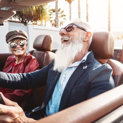 old man in convertible he bought after employing wealth protection strategies