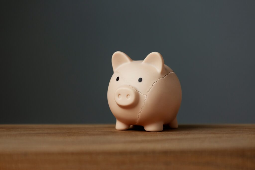 piggy bank on a desk for the article "the eight biggest mistakes investors make"