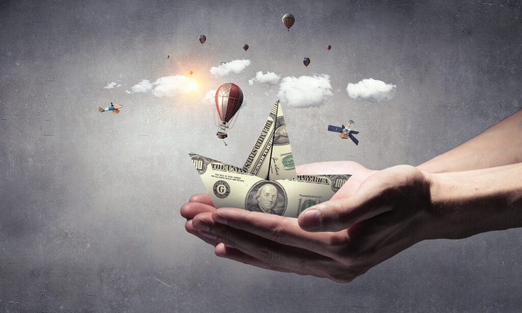 graphic illustration of hands holding a paper money boat for the blog what is a wealth manager